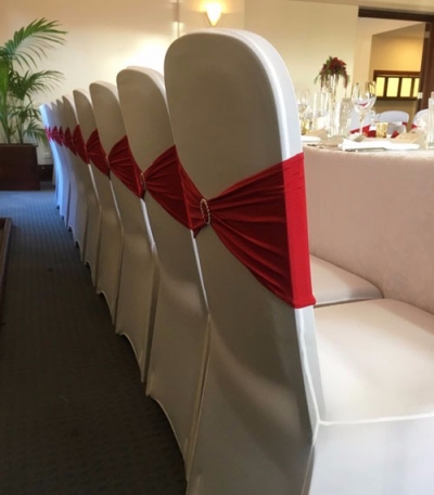Red lycra chair bands with diamonte brooche