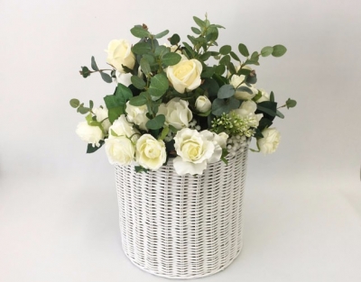 Cane basket with silk flowers 